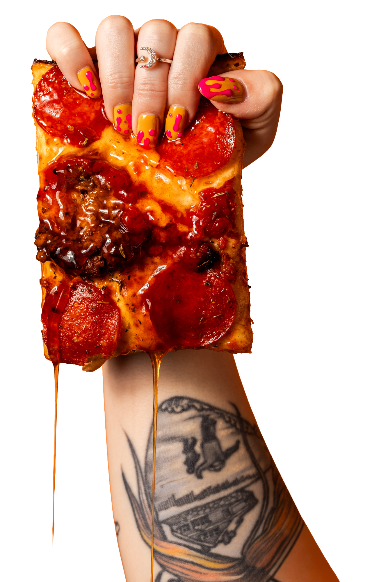 Hand holding a slice of pepperoni Detroit-style pizza with with hot honey glaze dripping from pizza.